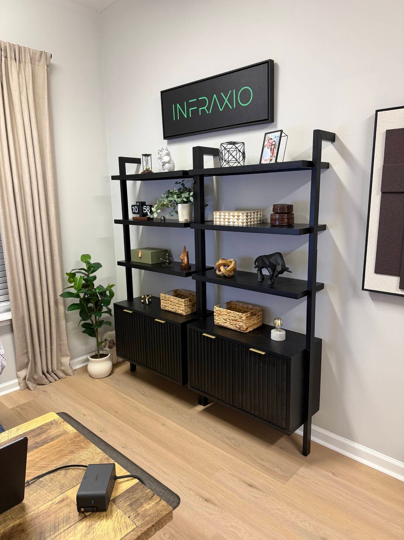 Home office shelving with the Infraxio sign